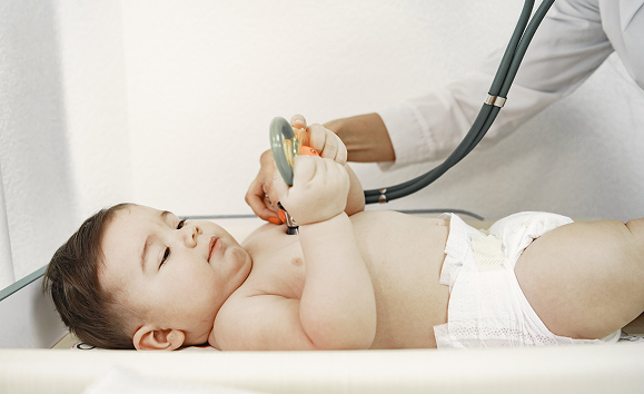 Doctor diagnosing a child for genetic test for children in Bahrain
